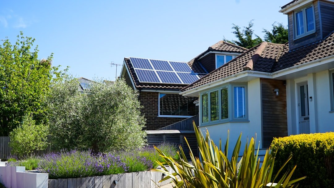 services-04 Solar panels in the midday sun on a house roof